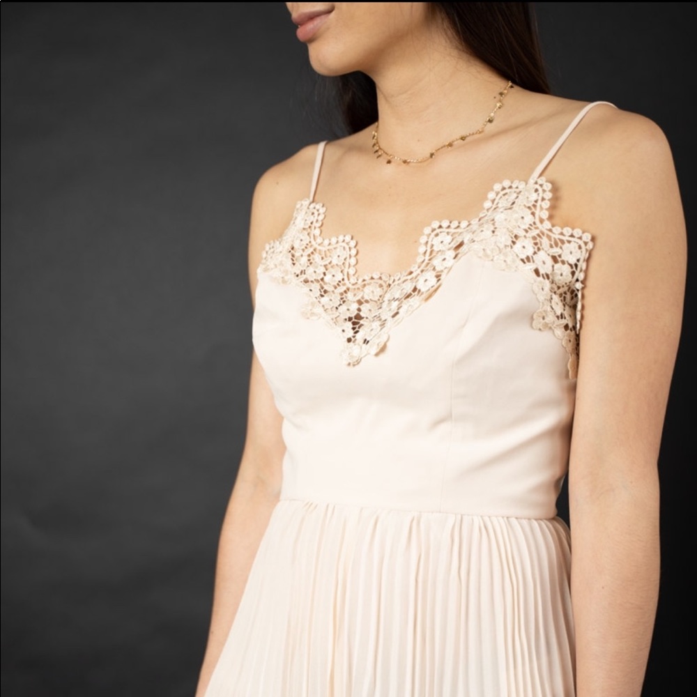 Cream romper, brand new.